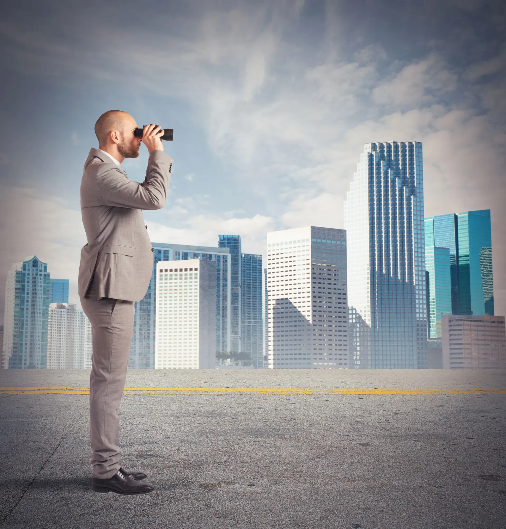 38004223 - businessman observes from a distance with binoculars Man looking thorugh binoculars