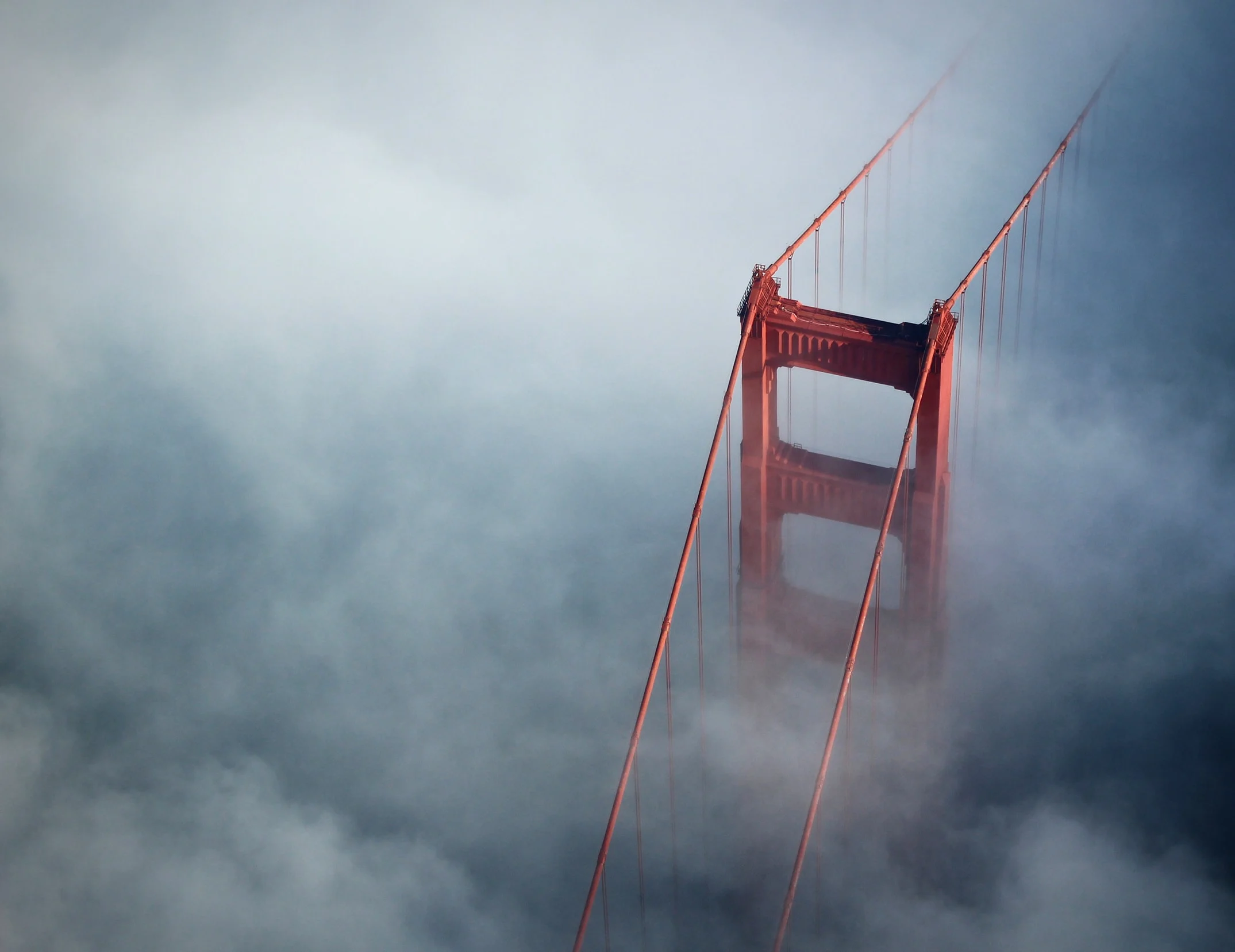 Golden Gate Bridge tower in fog