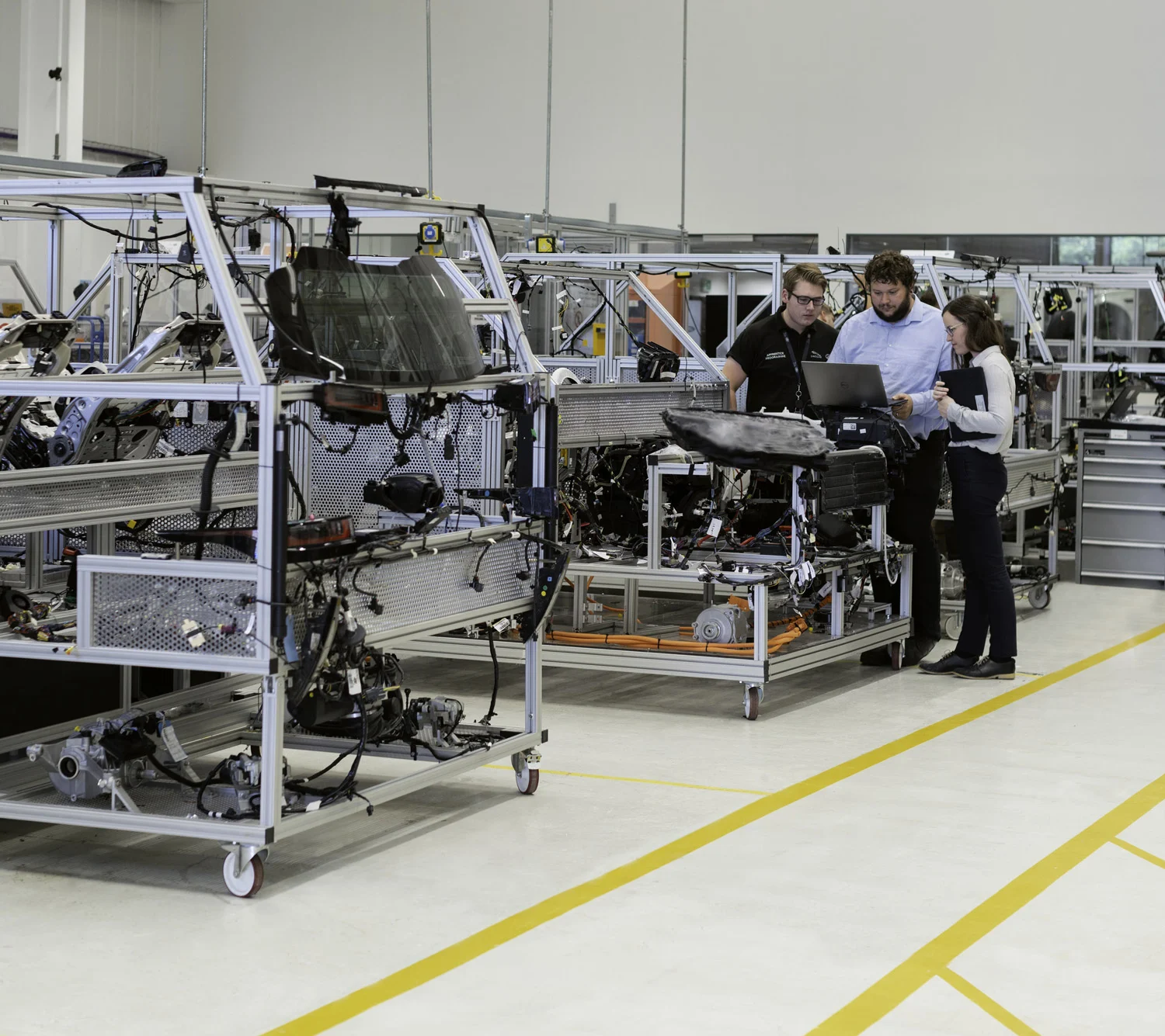 Workers on a Toyota vehicle assembly line