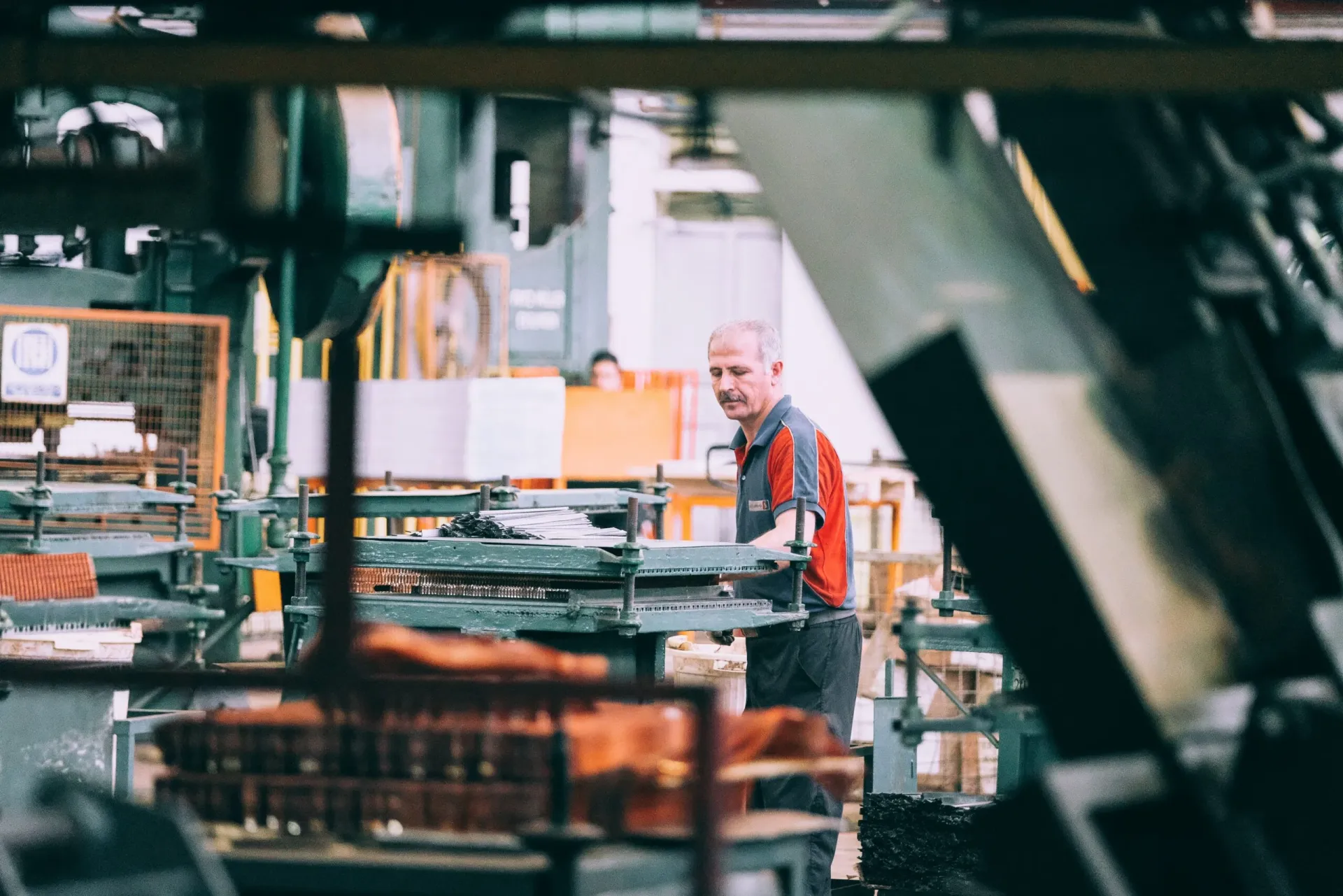 Worker operating industrial machinery