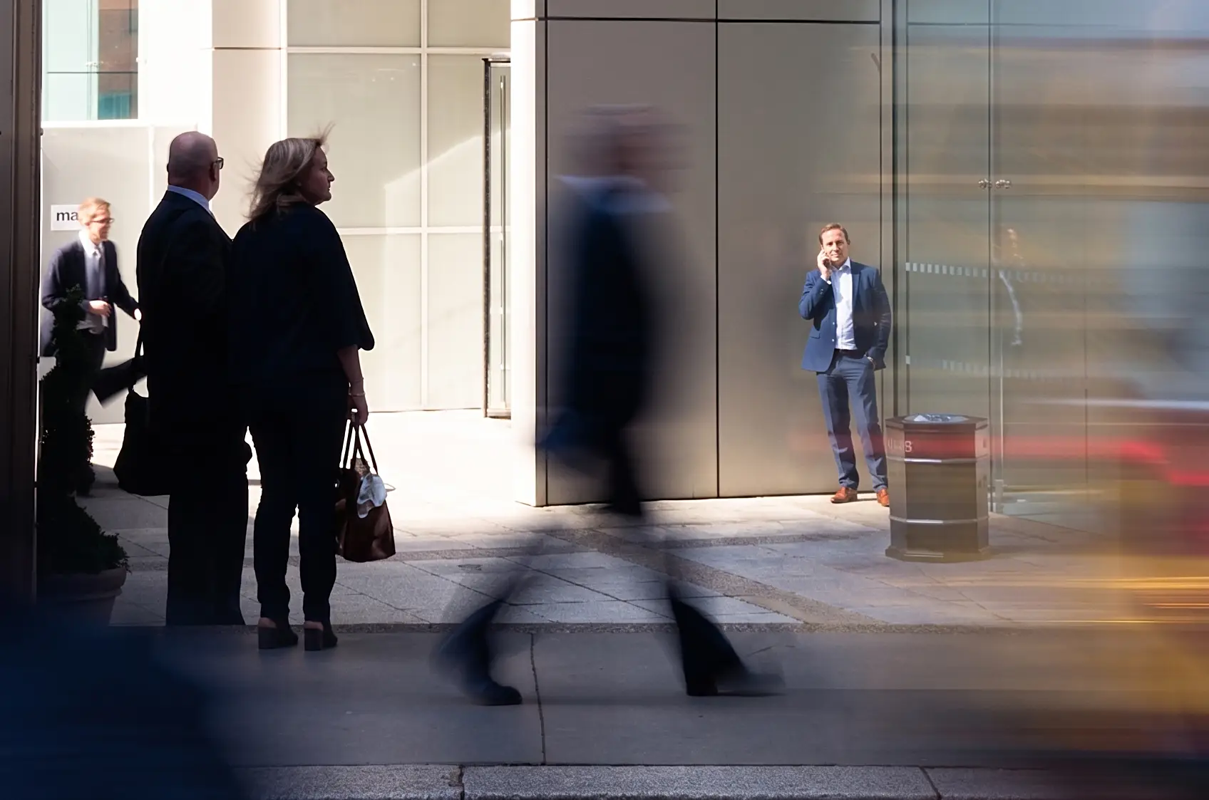 Business professionals meeting in an office lobby